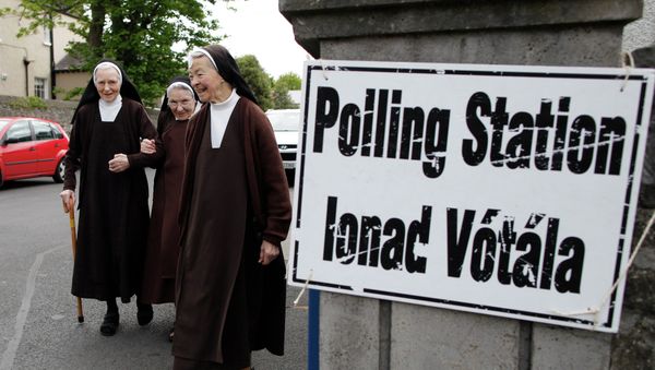 Carmelite sisters leave a polling station in Malahide, County Dublin, Ireland, Friday, May 22, 2015. Ireland began voting Friday in a referendum on gay marriage. - Sputnik International