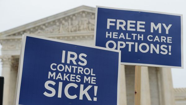 Protestors hold placards challenging Obamacare outside of the US Supreme Court on March 4, 2015 in Washington Protestors hold placards challenging Obamacare outside of the US Supreme Court on March 4, 2015 in Washington - Sputnik International