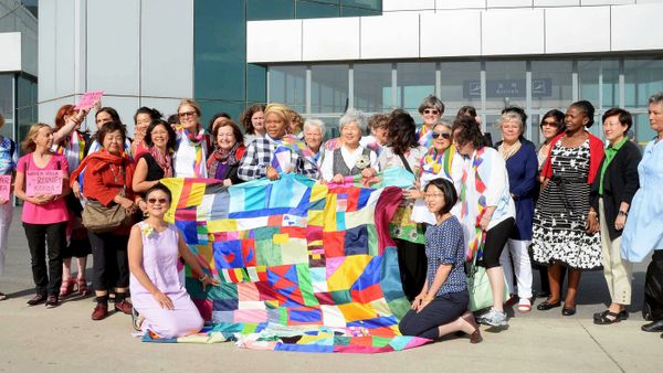 Female activists from around the world arrive at Pyongyang airport in Pyongyang, North Korea, in this photo taken and released by Kyodo May 19, 2015 Female activists from around the world arrive at Pyongyang airport in Pyongyang, North Korea, in this photo taken and released by Kyodo May 19, 2015 - Sputnik International