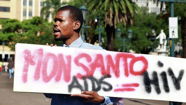 An activist carries a sign during a protest against chemical giant Monsanto in Durban on May 24, 2014 An activist carries a sign during a protest against chemical giant Monsanto in Durban on May 24, 2014 - Sputnik International