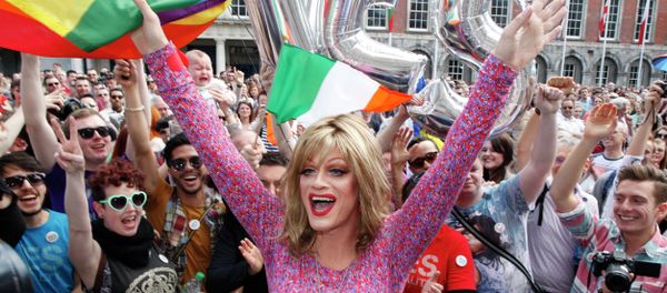 Rory O'Neill, known by the Drag persona Panti, celebrates with yes supporters at Dublin Castle, Ireland, Saturday, May 23, 2015. Ireland has voted resoundingly to legalize gay marriage in the world's first national vote on the issue, leaders on both sides of the Irish referendum declared Saturday even as official ballot counting continued. Senior figures from the no campaign, who sought to prevent Ireland's constitution from being amended to permit same-sex marriages, say the only question is how large the yes side's margin of victory will be from Friday's vote. Rory O'Neill, known by the Drag persona Panti, celebrates with yes supporters at Dublin Castle, Ireland, Saturday, May 23, 2015. Ireland has voted resoundingly to legalize gay marriage in the world's first national vote on the issue, leaders on both sides of the Irish referendum declared Saturday even as official ballot counting continued. Senior figures from the no campaign, who sought to prevent Ireland's constitution from being amended to permit same-sex marriages, say the only question is how large the yes side's margin of victory will be from Friday's vote. - Sputnik International