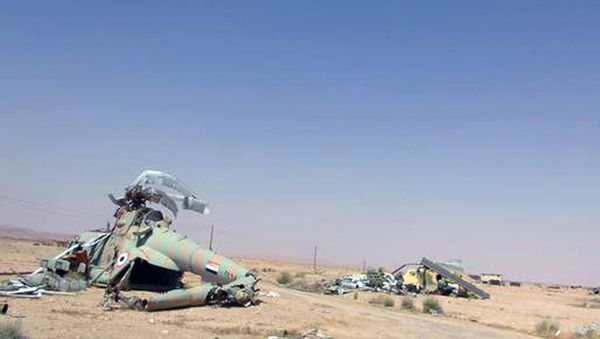 This picture released on Thursday, May 21, 2015 by the website of Islamic State militants, shows damaged Syrian military helicopters at Palmyra air base that was captured by the Islamic State militants after a battle with the Syrian government forces in Palmyra, Syria This picture released on Thursday, May 21, 2015 by the website of Islamic State militants, shows damaged Syrian military helicopters at Palmyra air base that was captured by the Islamic State militants after a battle with the Syrian government forces in Palmyra, Syria - Sputnik International