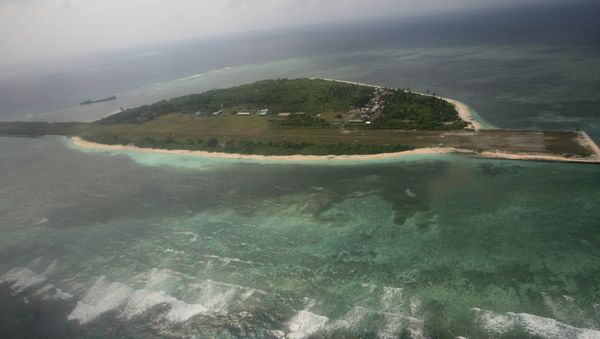 An aerial photo shows Thitu Island, part of the disputed Spratly group of islands, in the South China Sea located off the coast of western Philippines on July 20, 2011 An aerial photo shows Thitu Island, part of the disputed Spratly group of islands, in the South China Sea located off the coast of western Philippines on July 20, 2011 - Sputnik International