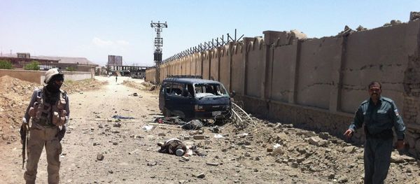 An insurgent's body lies on a street after he was shot to death near the provincial council building in Qalat in Zabul province, southwest of Kabul, Afghanistan, Monday, June 10, 2013 An insurgent's body lies on a street after he was shot to death near the provincial council building in Qalat in Zabul province, southwest of Kabul, Afghanistan, Monday, June 10, 2013 - Sputnik International