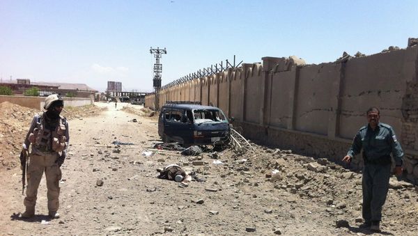 An insurgent's body lies on a street after he was shot to death near the provincial council building in Qalat in Zabul province, southwest of Kabul, Afghanistan, Monday, June 10, 2013 An insurgent's body lies on a street after he was shot to death near the provincial council building in Qalat in Zabul province, southwest of Kabul, Afghanistan, Monday, June 10, 2013 - Sputnik International