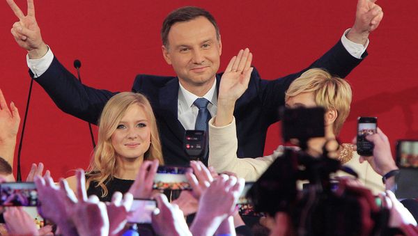 Opposition candidate Andrzej Duda, with daughter Kinga greet supporters as first exit polls in the presidential runoff voting are announced, in Warsaw, Poland, Sunday, May 24, 2015 Opposition candidate Andrzej Duda, with daughter Kinga greet supporters as first exit polls in the presidential runoff voting are announced, in Warsaw, Poland, Sunday, May 24, 2015 - Sputnik International