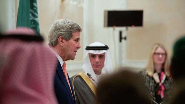 US State Department Acting Spokesperson Marie Harf look on as US Secretary of State addresses reporters during a news conference at Riyadh Air Base in Riyadh - Sputnik International