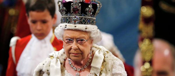 Britain's Queen Elizabeth is accompanied by Prince Philip as they proceed through the Royal Gallery before the State Opening of Parliament in the House of Lords, at the Palace of Westminster in London Britain May 27, 2015 - Sputnik International