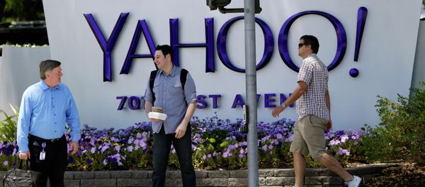 People walk in front of a Yahoo sign at the company's headquarters in Sunnyvale, California. People walk in front of a Yahoo sign at the company's headquarters in Sunnyvale, California. - Sputnik International