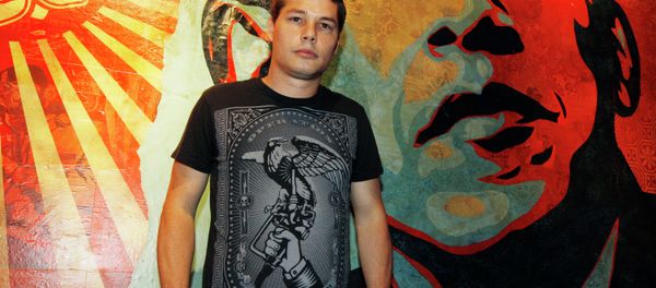 Artist Shepard Fairey poses for a portrait in front of a mural he created that was inspired by Barack Obama. - Sputnik International