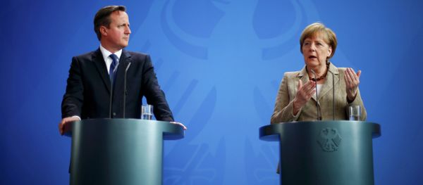 German Chancellor Angela Merkel and Britian's Prime Minister David Cameron address a joint news conference following a meeting at the Chancllery in Berlin, Germany - Sputnik International
