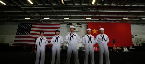 Chinese-American Navy sailors stand in front of the China's and American national flags on the aircraft carrier USS George Washington. Chinese-American Navy sailors stand in front of the China's and American national flags on the aircraft carrier USS George Washington. - Sputnik International