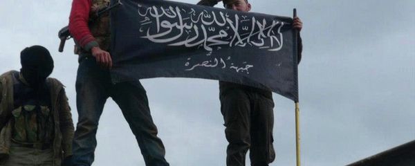 Rebels from al-Qaida-affiliated Jabhat al-Nusra, also known as the Nusra Front, wave their brigade flag, as they step on the top of a Syrian air force helicopter. Rebels from al-Qaida-affiliated Jabhat al-Nusra, also known as the Nusra Front, wave their brigade flag, as they step on the top of a Syrian air force helicopter. - Sputnik International