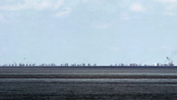 The alleged on-going reclamation of Subi Reef by China is seen from Pag-asa Island in the Spratly Islands in the South China Sea, western Palawan Province, Philippines Monday, May 11, 2015 - Sputnik International