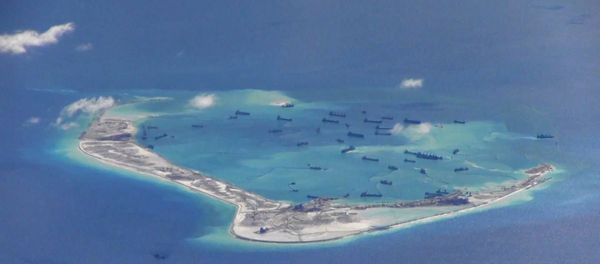 Chinese dredging vessels are purportedly seen in the waters around Mischief Reef in the disputed Spratly Islands in the South China Sea, in this file still image from video taken by a P-8A Poseidon surveillance aircraft and provided by the United States Navy on May 21, 2015 Chinese dredging vessels are purportedly seen in the waters around Mischief Reef in the disputed Spratly Islands in the South China Sea, in this file still image from video taken by a P-8A Poseidon surveillance aircraft and provided by the United States Navy on May 21, 2015 - Sputnik International