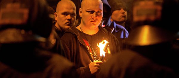 A neo-Nazi surrounded by riot police holds a torch during a rally to commemorate the 68nd anniversary of the bombing of Dresden - Sputnik International