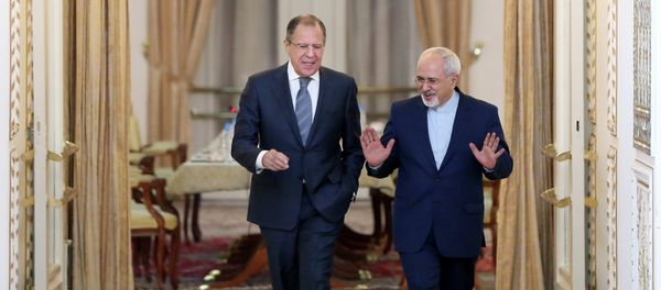 Iranian Foreign Minister Mohammad Javad Zarif, right, and his Russian counterpart Sergey Lavrov arrive to their joint press conference in Tehran, Iran - Sputnik International