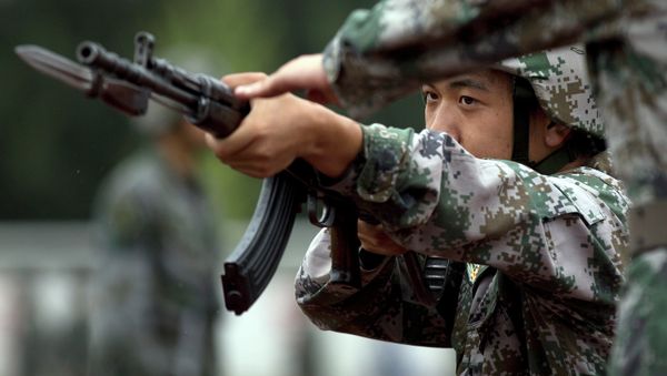 Chinese People's Liberation Army cadets take part in a bayonet drills at the PLA's Armoured Forces Engineering Academy Base - Sputnik International