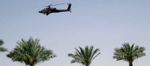 An Egyptian army helicopter patrols the venue of a meeting of Arab heads of state, in Sharm el Sheik, South Sinai, Egypt, Saturday, March 28, 2015 - Sputnik International