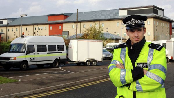 A British police officer guards the entrance to the Harmondsworth Immigration Detention Center, outside London, England. A British police officer guards the entrance to the Harmondsworth Immigration Detention Center, outside London, England. - Sputnik International