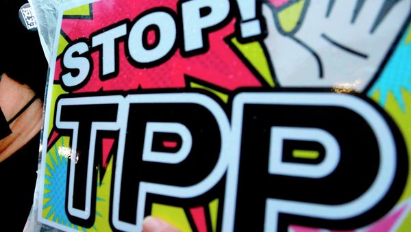 A placard during a rally against the Trans-Pacific Partnership (TPP) A placard during a rally against the Trans-Pacific Partnership (TPP) - Sputnik International