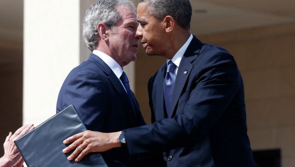 President Barack Obama embraces former President George W. Bush after he spoke at the dedication of the George W. Bush presidential library. - Sputnik International