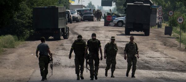 Ukrainian servicemen from battalion Kiev1 walk outside a checkpoint near Marinka, Donetsk region, eastern Ukraine Ukrainian servicemen from battalion Kiev1 walk outside a checkpoint near Marinka, Donetsk region, eastern Ukraine - Sputnik International