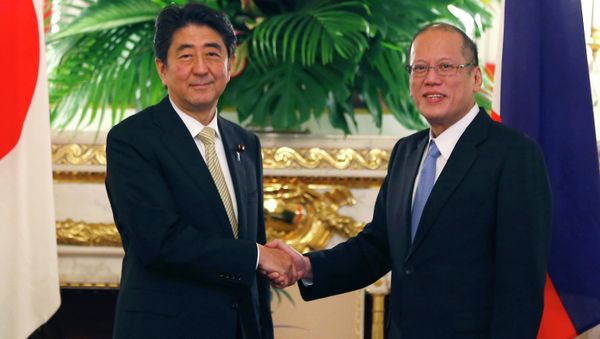 Philippine President Benigno Aquino III, right, shakes hands with Japanese Prime Minister Shinzo Abe. Philippine President Benigno Aquino III, right, shakes hands with Japanese Prime Minister Shinzo Abe. - Sputnik International