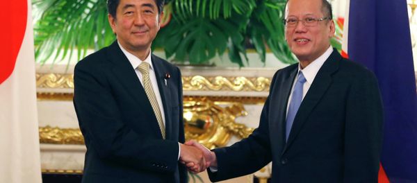 Philippine President Benigno Aquino III, right, shakes hands with Japanese Prime Minister Shinzo Abe. Philippine President Benigno Aquino III, right, shakes hands with Japanese Prime Minister Shinzo Abe. - Sputnik International