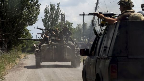 Members of the Ukrainian armed forces ride on an armoured personnel carrier as they patrol the area in the town of Maryinka, eastern Ukraine, June 5, 2015 Members of the Ukrainian armed forces ride on an armoured personnel carrier as they patrol the area in the town of Maryinka, eastern Ukraine, June 5, 2015 - Sputnik International