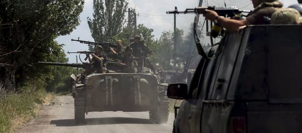 Members of the Ukrainian armed forces ride on an armoured personnel carrier as they patrol the area in the town of Maryinka, eastern Ukraine, June 5, 2015 Members of the Ukrainian armed forces ride on an armoured personnel carrier as they patrol the area in the town of Maryinka, eastern Ukraine, June 5, 2015 - Sputnik International