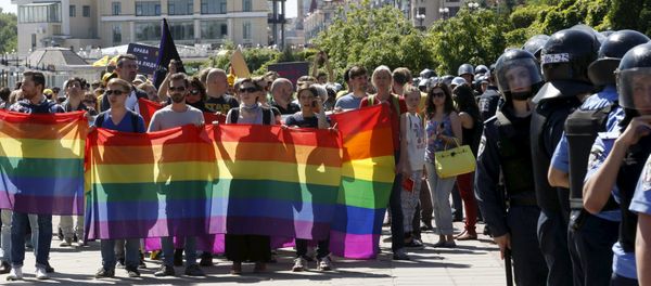 Interior Ministry members stand guard as activists take part in the so-called Equality March, organized by a lesbian, gay, bisexual and transgender (LGBT) community, in Kiev, Ukraine Interior Ministry members stand guard as activists take part in the so-called Equality March, organized by a lesbian, gay, bisexual and transgender (LGBT) community, in Kiev, Ukraine - Sputnik International