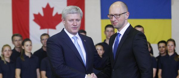 Ukrainian Prime Minister Arseniy Yatsenyuk (R) welcomes his Canadian counterpart Stephen Harper during their meeting in Kiev Ukrainian Prime Minister Arseniy Yatsenyuk (R) welcomes his Canadian counterpart Stephen Harper during their meeting in Kiev - Sputnik International