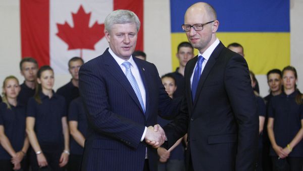 Ukrainian Prime Minister Arseniy Yatsenyuk (R) welcomes his Canadian counterpart Stephen Harper during their meeting in Kiev Ukrainian Prime Minister Arseniy Yatsenyuk (R) welcomes his Canadian counterpart Stephen Harper during their meeting in Kiev - Sputnik International