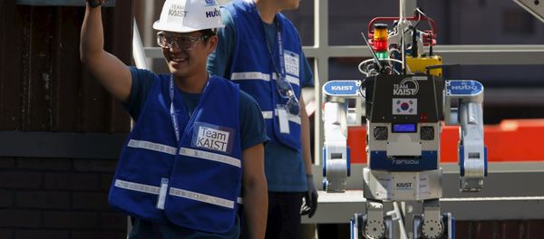 A member of Team KAIST DRC-Hubo celebrates after completing their run in the finals of the Defense Advanced Research Projects Agency (DARPA) Robotic Challenge in Pomona, California June 6, 2015. A member of Team KAIST DRC-Hubo celebrates after completing their run in the finals of the Defense Advanced Research Projects Agency (DARPA) Robotic Challenge in Pomona, California June 6, 2015. - Sputnik International