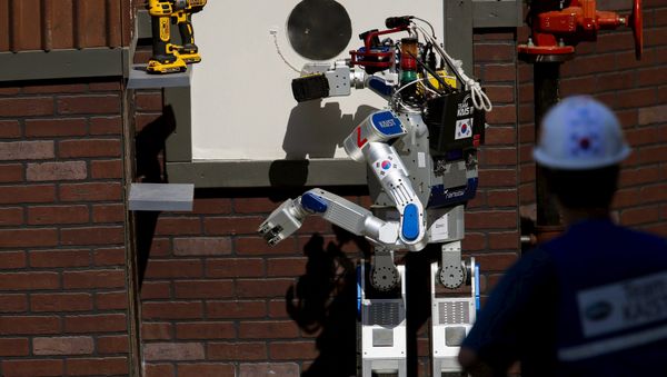 The Team KAIST DRC-Hubo robot completes the cutting task before winning the finals of the Defense Advanced Research Projects Agency (DARPA) Robotic Challenge in Pomona, California June 6, 2015 - Sputnik International