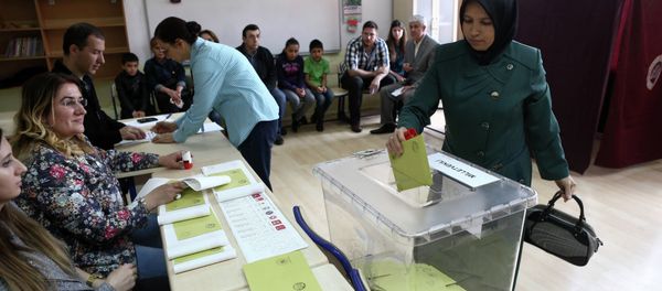 A Turkish woman casts her ballot as she votes in Turkey's general election at a polling station in a primary school in Ankara on June 7, 2015 A Turkish woman casts her ballot as she votes in Turkey's general election at a polling station in a primary school in Ankara on June 7, 2015 - Sputnik International