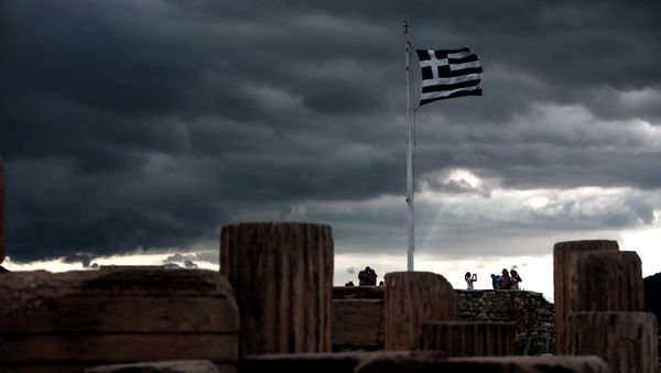 A Greek flag waves in the breeze at Acropolis hill, in Athens on June 5, 2015 A Greek flag waves in the breeze at Acropolis hill, in Athens on June 5, 2015 - Sputnik International