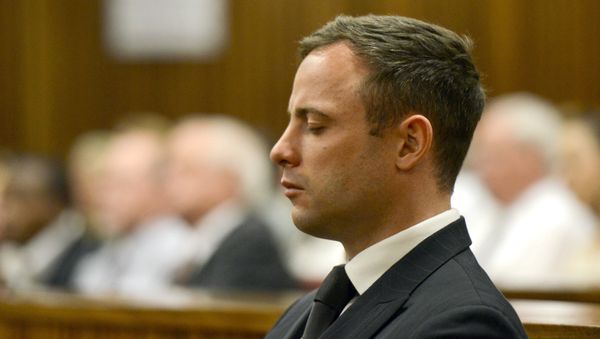 Paralympian Oscar Pistorius is seen during his sentencing for the killing of his girlfriend Reeva Steenkamp at the high court in Pretoria, on October 21, 2014 - Sputnik International