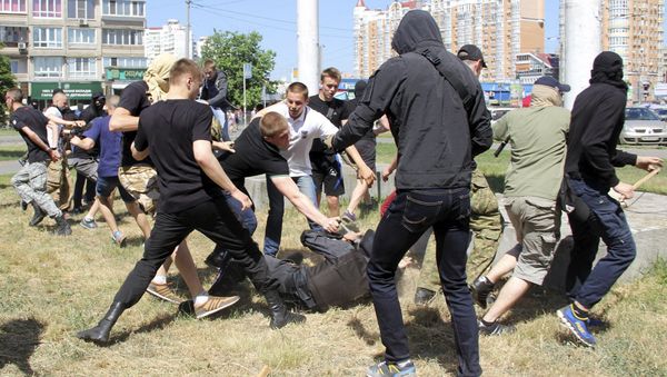 Anti-gay protesters attack a policeman during the so-called Equality March, organized by a lesbian, gay, bisexual and transgender (LGBT) community, in Kiev, Ukraine, June 6, 2015 Anti-gay protesters attack a policeman during the so-called Equality March, organized by a lesbian, gay, bisexual and transgender (LGBT) community, in Kiev, Ukraine, June 6, 2015 - Sputnik International