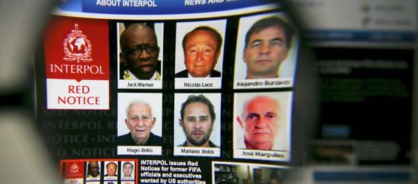 The homepage of the Interpol website is seen through a magnifying glass in this picture illustration taken in Berlin, Germany June 3, 2015 The homepage of the Interpol website is seen through a magnifying glass in this picture illustration taken in Berlin, Germany June 3, 2015 - Sputnik International