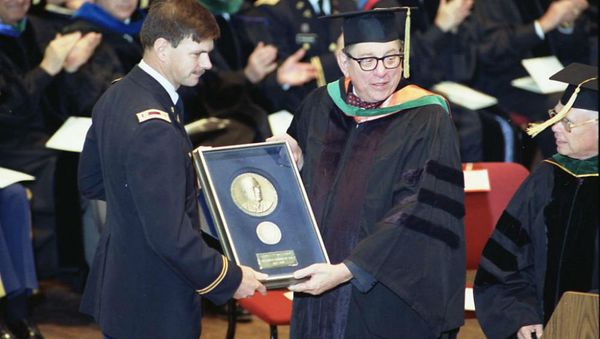 US Army Medical Corps retired Lt. Colonel John Hagmann (L) is seen being presented the William P. Clements, Jr. Outstanding Uniformed Educator Award by Dr. Sam Nixon (R) during the US Military's Uniformed Services University of the Health Sciences 1989 Commencement Exercises in this USUHS handout file photo taken in Washington May 20, 1989. US Army Medical Corps retired Lt. Colonel John Hagmann (L) is seen being presented the William P. Clements, Jr. Outstanding Uniformed Educator Award by Dr. Sam Nixon (R) during the US Military's Uniformed Services University of the Health Sciences 1989 Commencement Exercises in this USUHS handout file photo taken in Washington May 20, 1989. - Sputnik International