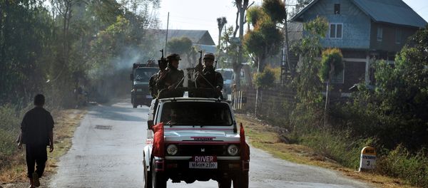 In this photograph taken on February 18, 2012, a vehicle carrying armed security personnel passes along a road on the outskirts of Imphal in the north eastern Indian state of Manipur In this photograph taken on February 18, 2012, a vehicle carrying armed security personnel passes along a road on the outskirts of Imphal in the north eastern Indian state of Manipur - Sputnik International