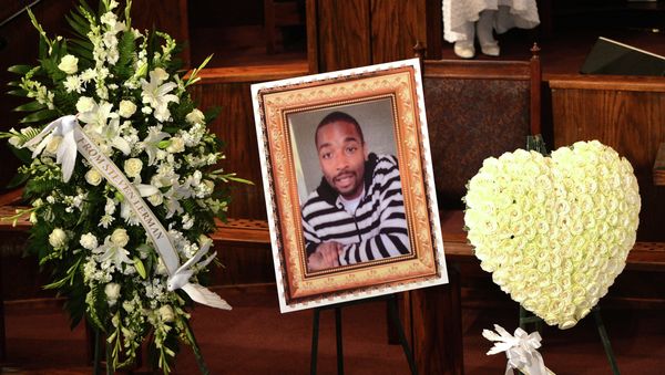 (FILES) In this August 30, 2014 file photo, a photo of Ezell Ford is seen at his funeral service at the First AME Church in Los Angeles - Sputnik International