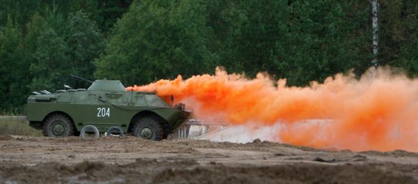 An armored vehicle sets a smokescreen An armored vehicle sets a smokescreen - Sputnik International