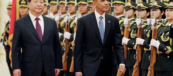 U.S. President Barack Obama and Chinese President Xi Jinping review the honor guard during a welcome ceremony at the Great Hall of the People in Beijing, Wednesday, Nov. 12, 2014. U.S. President Barack Obama and Chinese President Xi Jinping review the honor guard during a welcome ceremony at the Great Hall of the People in Beijing, Wednesday, Nov. 12, 2014. - Sputnik International