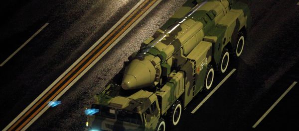 A Chinese military vehicle carries a DF21 medium range ballistic missile. - Sputnik International