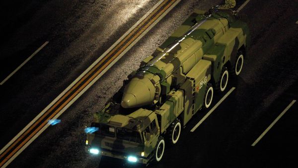 A Chinese military vehicle carries a DF21 medium range ballistic missile. - Sputnik International