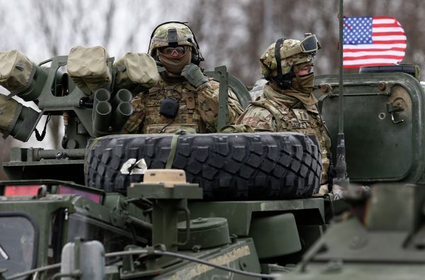 Members of US Army’s 2nd Cavalry Regiment ride on an armored vehicle Members of US Army’s 2nd Cavalry Regiment ride on an armored vehicle - Sputnik International