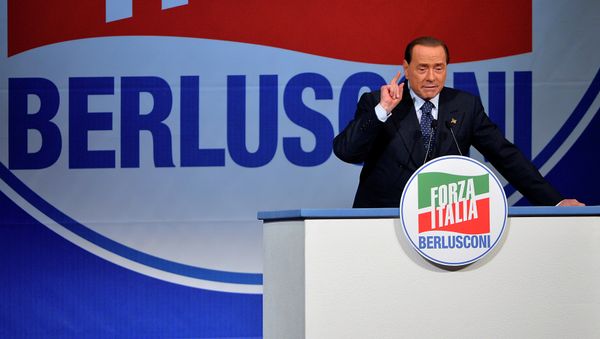 Former Italian Prime Minister and president of the Italian center-right Forza Italia (FI) party, Silvio Berlusconi gives a speech on May 22, 2014 in Rome Former Italian Prime Minister and president of the Italian center-right Forza Italia (FI) party, Silvio Berlusconi gives a speech on May 22, 2014 in Rome - Sputnik International